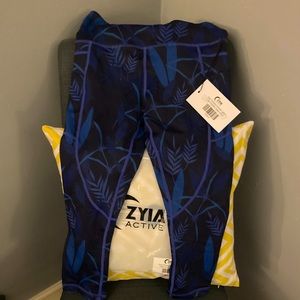 ZYIA- Active Wear. Azul Paradise Light N Tight w/ pocket. High Rise Capri
